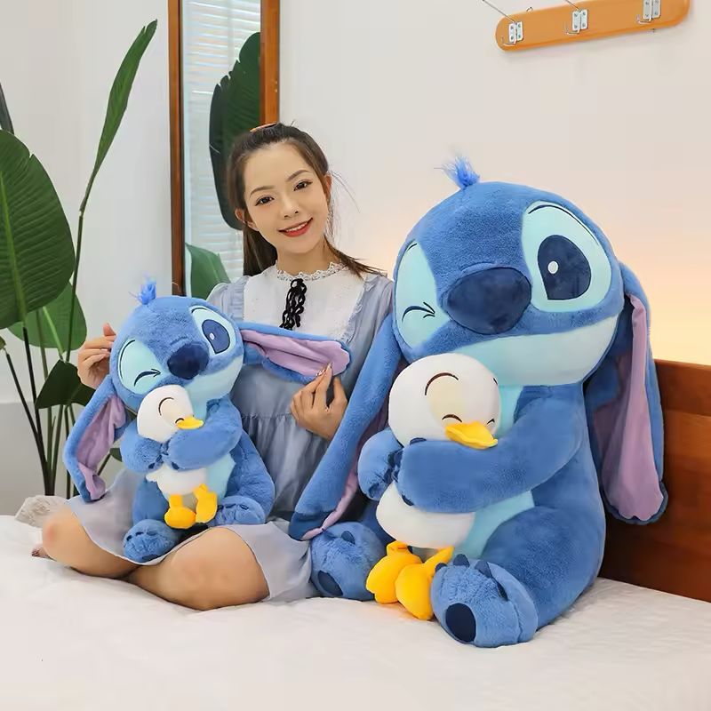 Stitch holding a duck plush toy