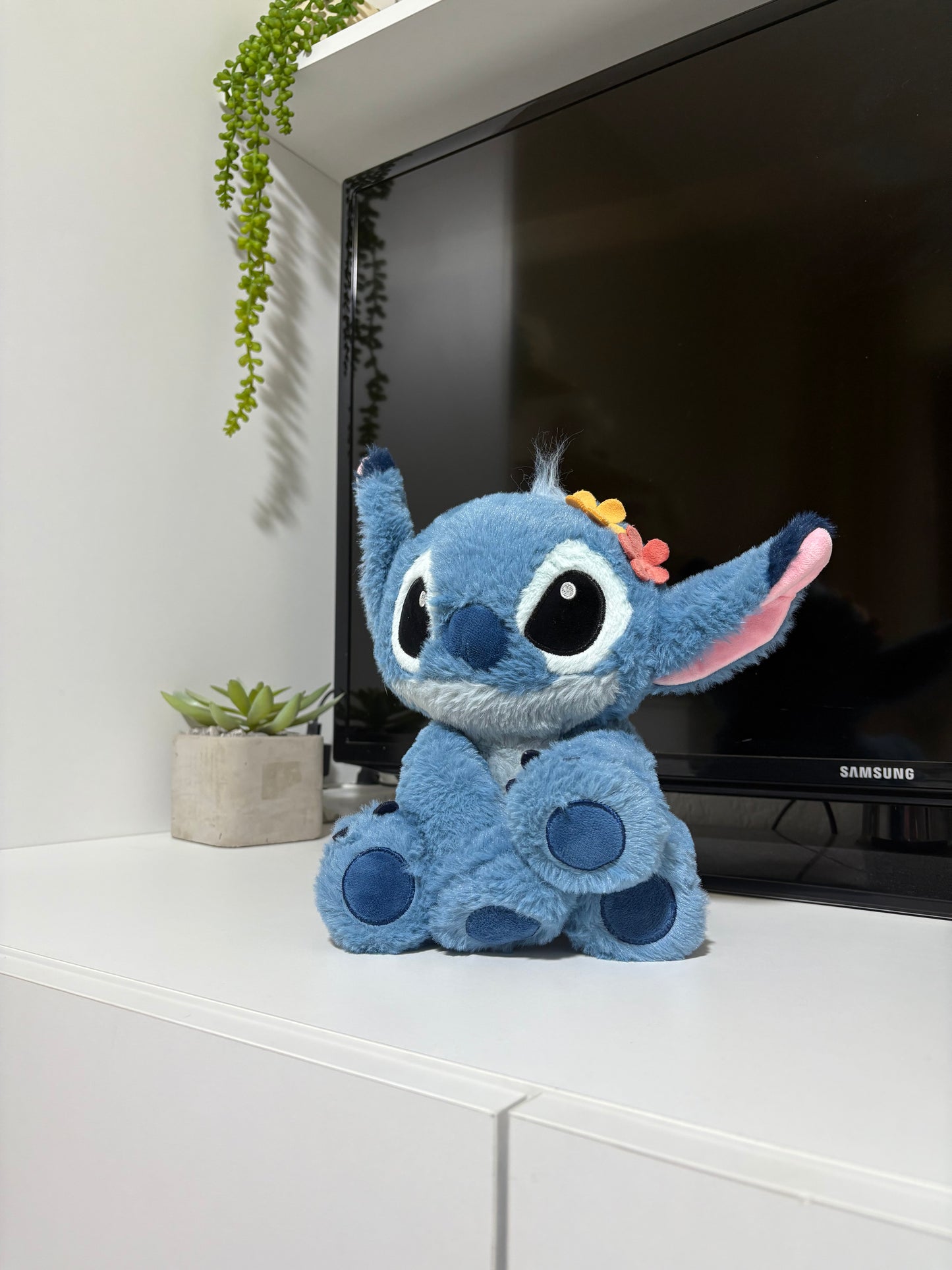 Stitch with flowers on his head plush toy
