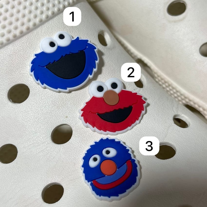 Cookie monster and Elmo charm