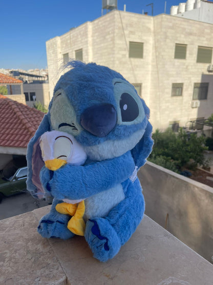 Stitch holding a duck plush toy