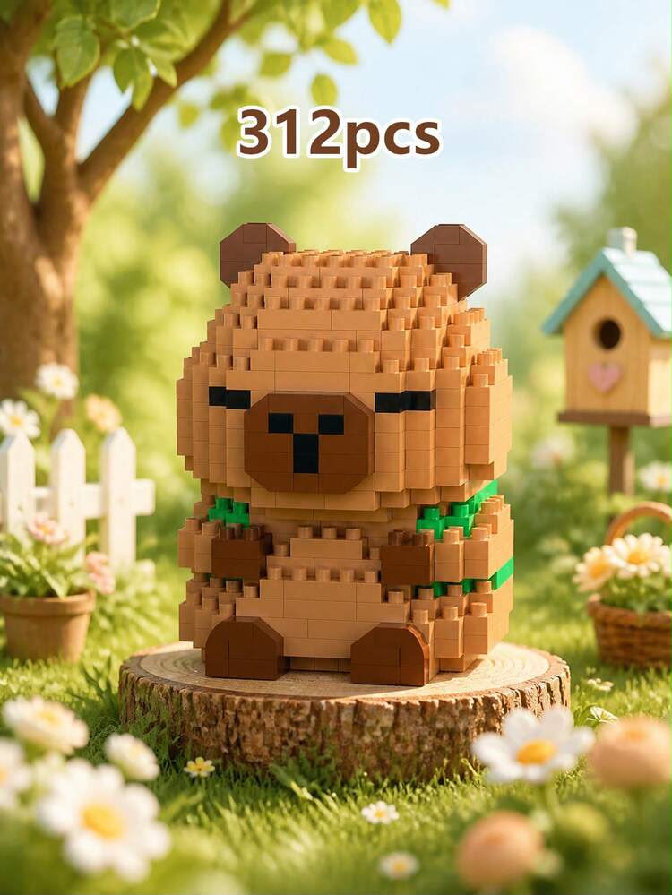 A small block-built bear toy made of tan and brown bricks with green accents, displayed on a tree stump in a grassy garden scene. The text '312pcs' appears above the toy.