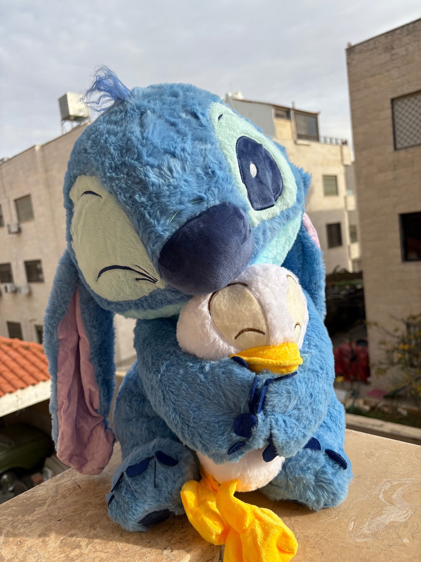 Stitch holding a duck plush toy (55 cm )