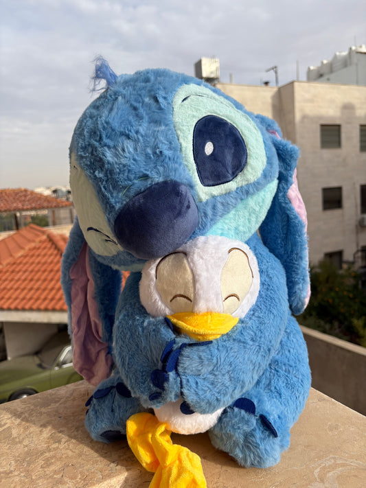 Stitch holding a duck plush toy (55 cm )
