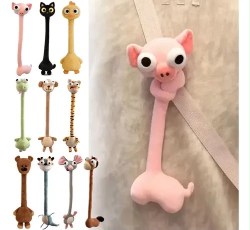 A pink pig-shaped hanging hook with a long neck and large eyes, shown attached to a beige strap on a light wall. Smaller thumbnails along the left show additional animal hook designs in pink, black, yellow, green, tan, brown, and blue.
