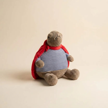 Grumpy Superhero Turtle Plush Toy – Striped Shirt & Red Cape
 - 30 cm