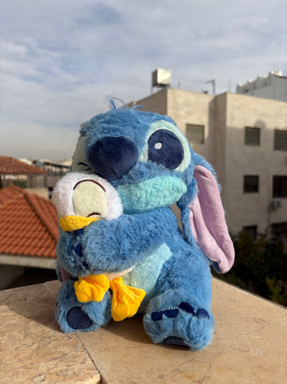Stitch holding a duck plush toy (30 cm )