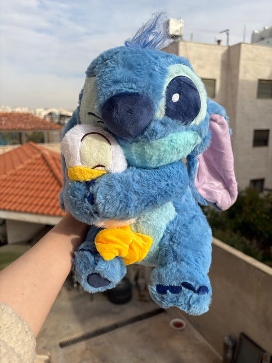 Stitch holding a duck plush toy (30 cm )