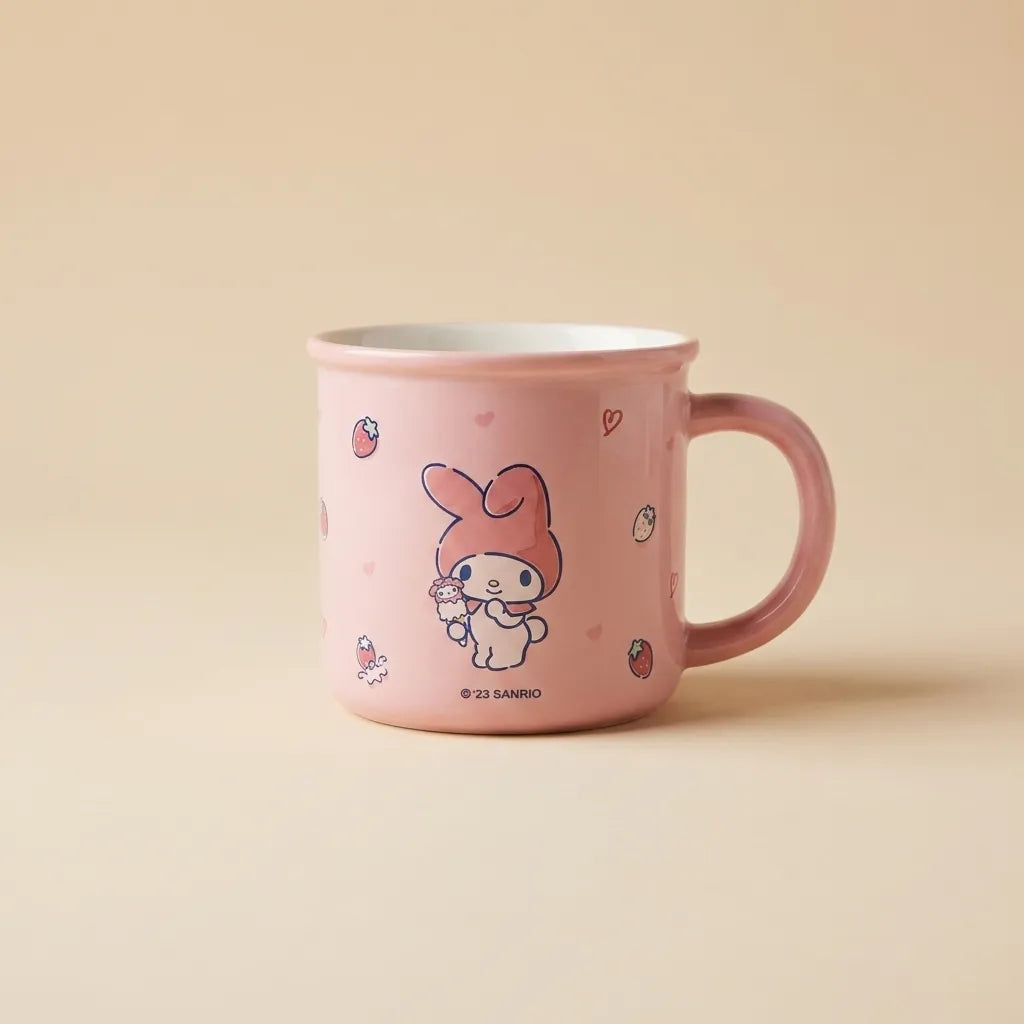 A pink ceramic mug featuring a cute cartoon bunny character holding a flower, with small strawberry and heart motifs. The mug has a white interior and a pink handle, set against a solid beige background.