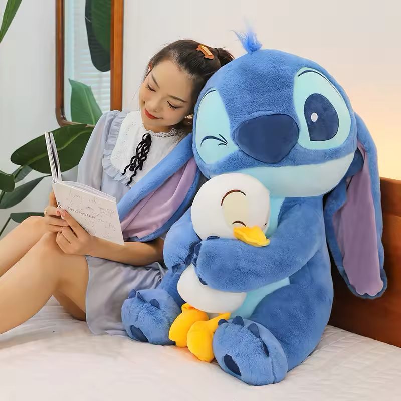 Stitch holding a duck plush toy