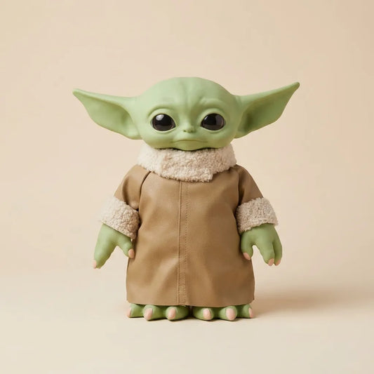 A collectible figurine of Grogu / The Child from The Mandalorian, featuring green skin, large black eyes, and a tan robe with cream sherpa lining, set against a solid beige background.