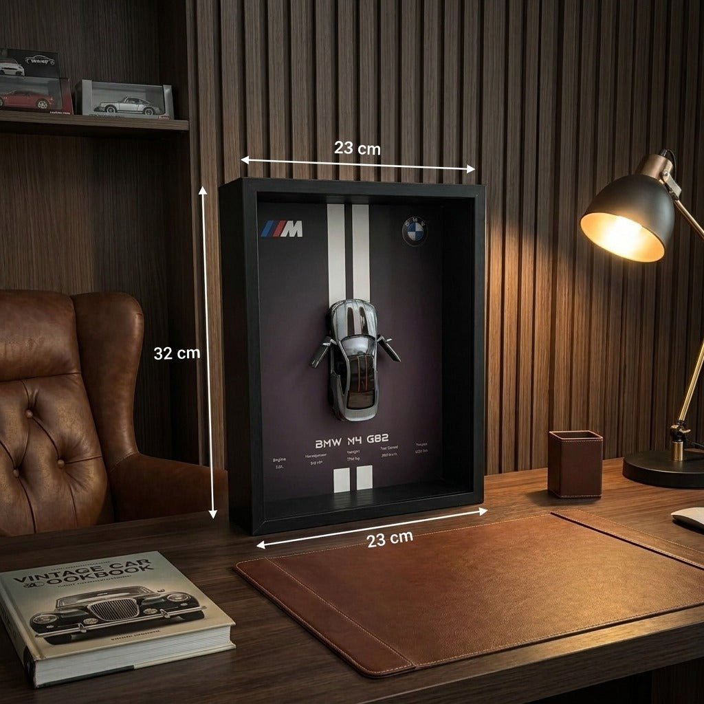 BMW M4 3D Framed Diecast Wall Art in a 32cm x 23cm black shadow box frame, featuring a grey 1:32 scale model car with open doors against an M-Power design background with performance stats.