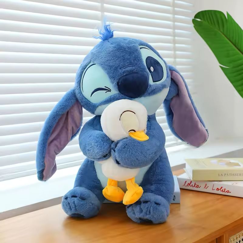 Stitch holding a duck plush toy