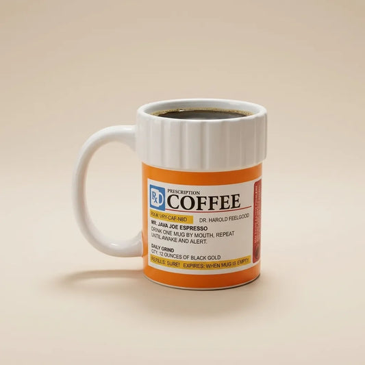 A white ceramic coffee mug with a handle, filled with black coffee, featuring a retro orange and white label styled like a prescription bottle. The mug is set against a solid, warm beige background.