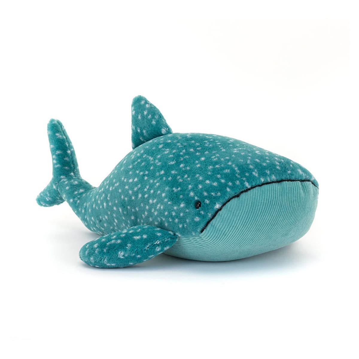 Teal plush whale toy with white spots on a white background