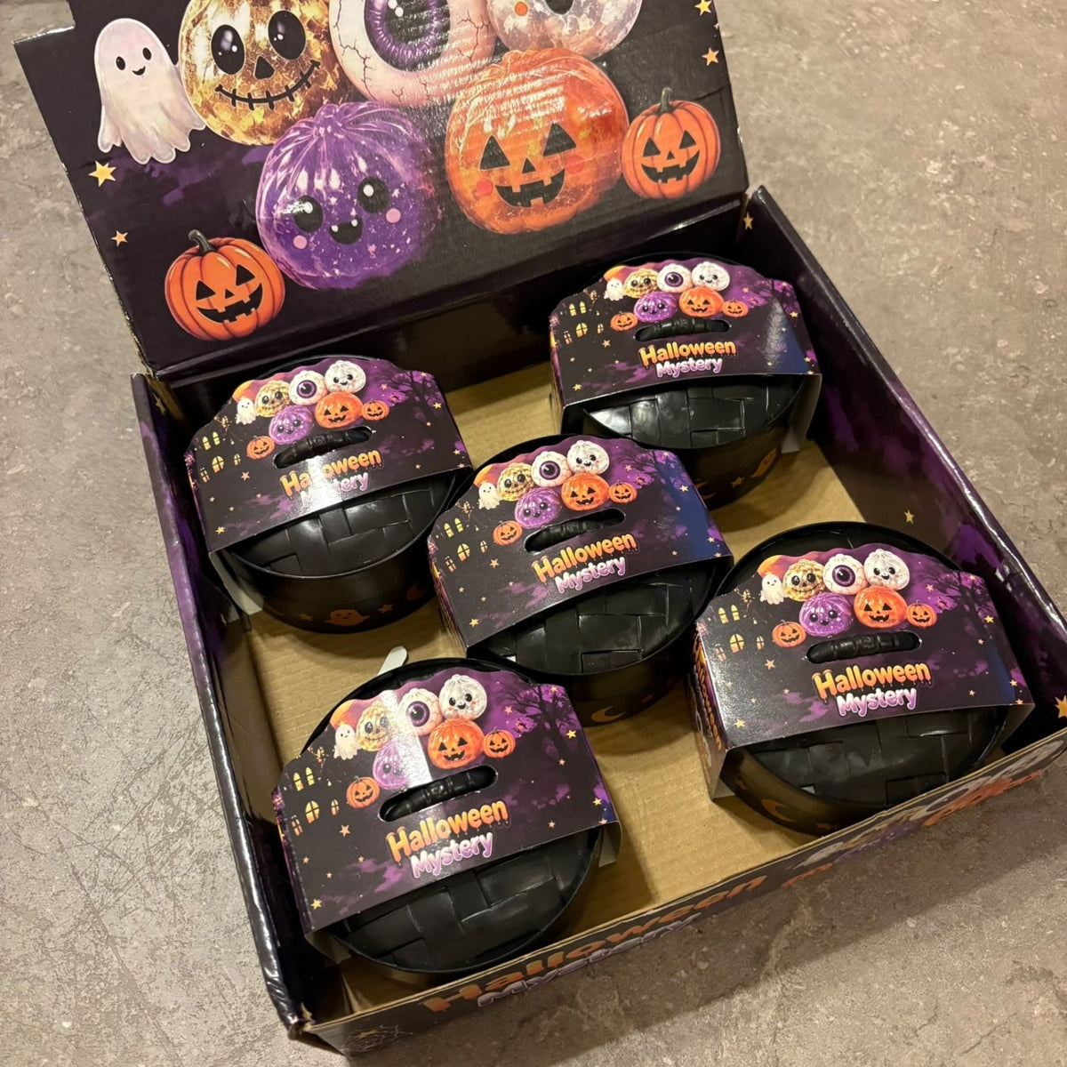 Glitter Dumpling Squishy Toy Halloween Edition blind box packaging, featuring a cute and stretchy novelty stress toy with sparkly glitter filling.