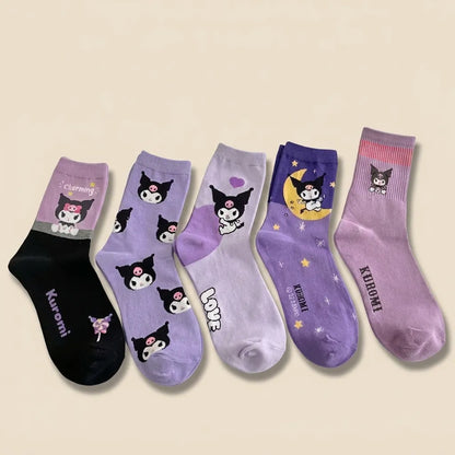 Five pairs of Kuromi-themed crew socks in various colors and patterns, arranged in a fan shape on a light beige background.