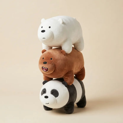 Three plush toys stacked on top of each other: a white polar bear on top, a brown grizzly bear in the middle, and a black-and-white panda at the bottom, photographed on a plain warm beige background.